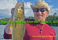 image of Josh Hoffert with big walleye caught on a wiggle worm