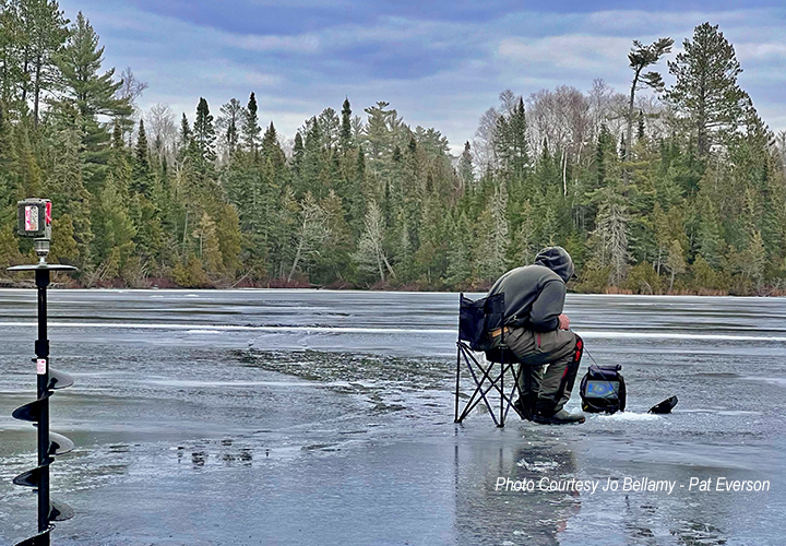 image of pat everson ice fishing in northeastern minnesota