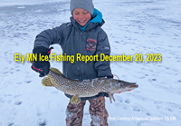 image of youngster holding big northern pike