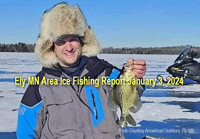 image of ice fisherman showing off nice crappie