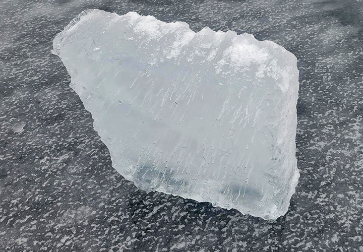 image of air trapped in ice cut from the surface of Lake Winnie