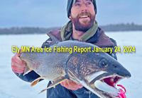 image of ice fisherman holding big lake trout caught near Ely Minnesota