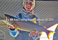 image of ice fisherman holding nice size lake trrout