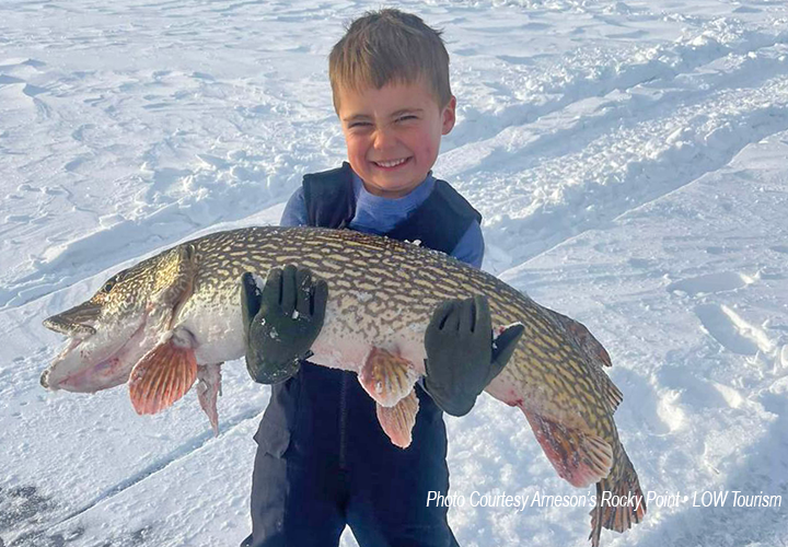 image of young angler with monster northern pike from Arneson's Rocky Point Resort