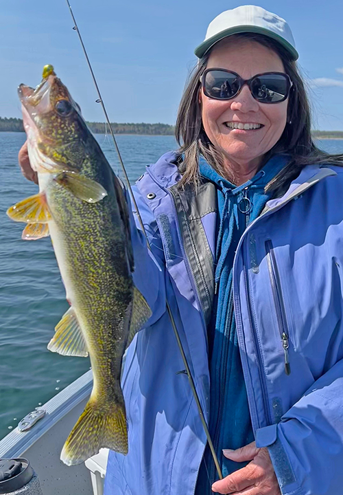 image of the Hippie Chick with a nice Lake Winnie Walleye