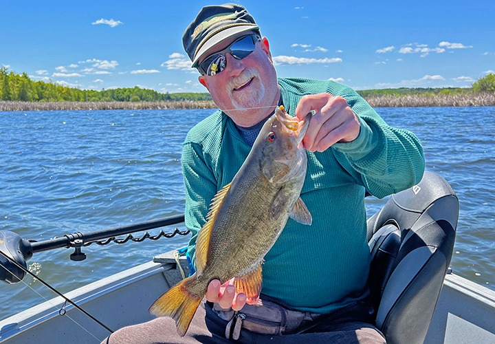 Image of larry lashley with nice smallmouth bass in the grand rapids minnesota area