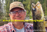 image of walleye angler holding nic fish caught near Ely MN