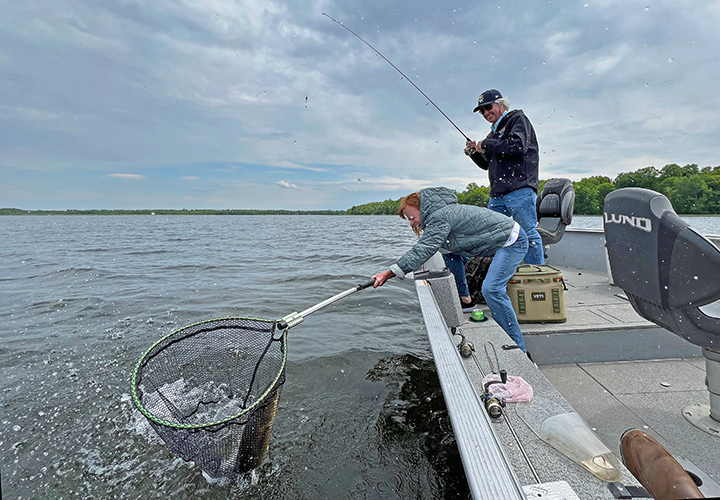 image of Janet and Marty Christensen landing a big walleye