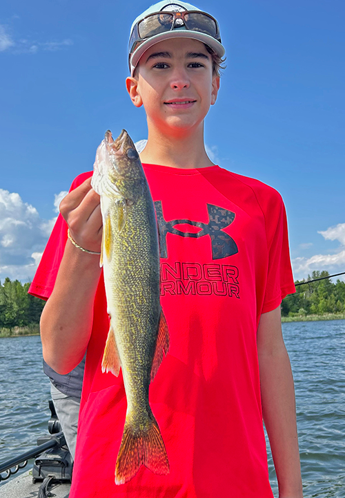 image of cade jacobs with nice walleye caught on Lake Winnie