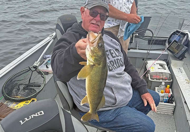 image of Mark Gerdes with a big walleye caught on a charter with Jeff Sundin 