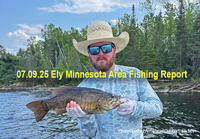 image of fisherman holding nice smallmouth bass he caught near Ely Minnesota