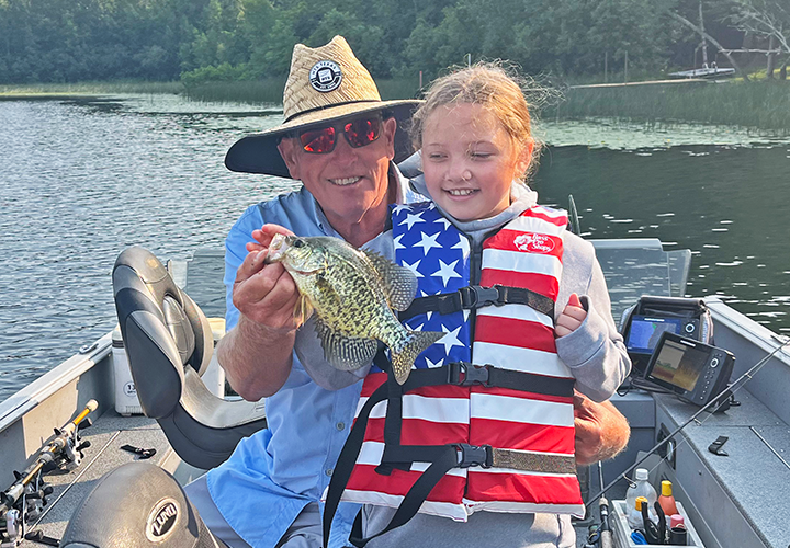Lucy Patterson and Jeff Sundin showing off a nice crappie