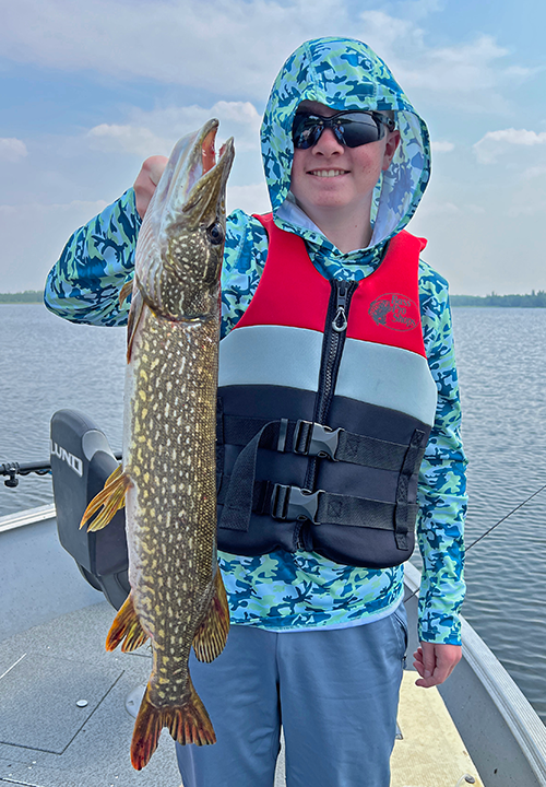 Landry Patterson shows off his largest ever northern pike