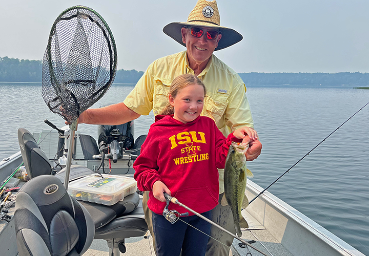 image of Lucy Patterson with nice largemouth bass caught on fishing charter with Jeff Sundin 