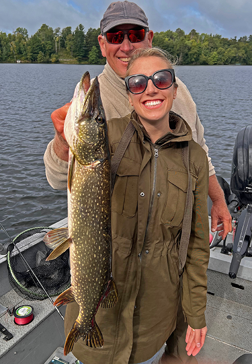 image of Ashley Clevenger with northern pike caught while fishing in Minnesota with jeff Sundin 