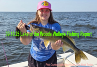 image of young woman holding big walleye on Lake of the Woods fishing charter