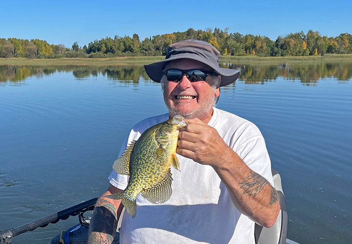 Kyle Reynolds with big crappie caught on a fishing charter with Jeff Sundin 
