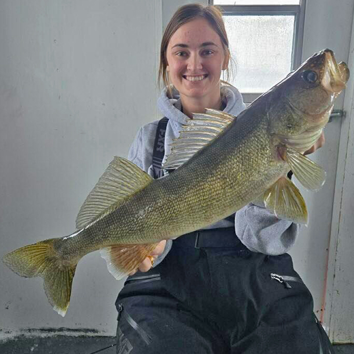 image of Macey with huge walleye caught at Arnesen's Resort on Lake of the Woods 