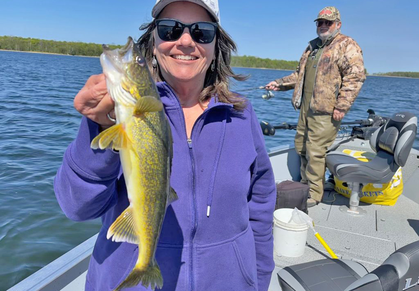 image of the Hippie Chick holding nice walleye caught on Lake Winnie