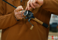 image links to fishing article about how to properly spool a fishing reel with braided fishing line