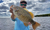 image links to fishing article about catching bass during mid-summer 