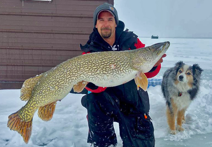 image of Greg Ruatti with giant lake of the woods northern pike