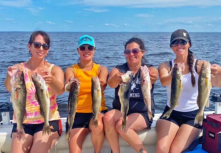 image of 4 beautiful women fishing walleyes on Lake of the Woods