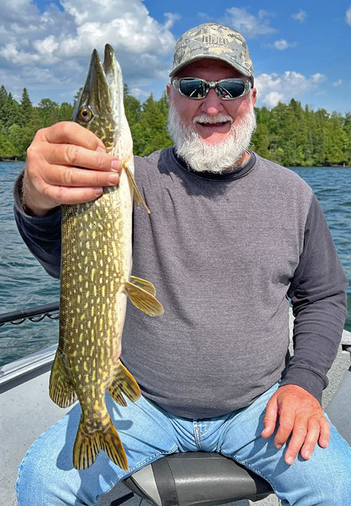 image of Bobby Cox holding nice size pike